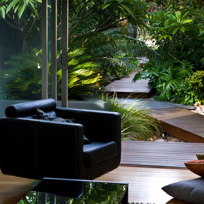 Inspiration for a small contemporary front yard water fountain landscape in Perth with decking.