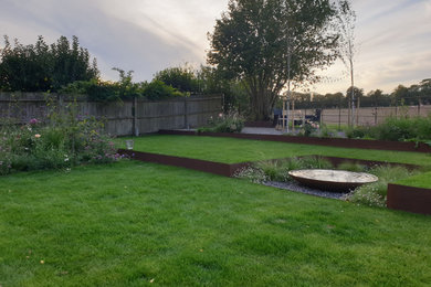 Inspiration for a medium sized contemporary back formal full sun garden for summer in Hampshire.