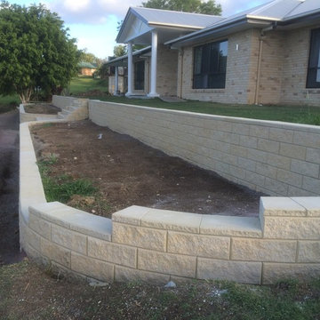 Modern stone retaining wall and large steps