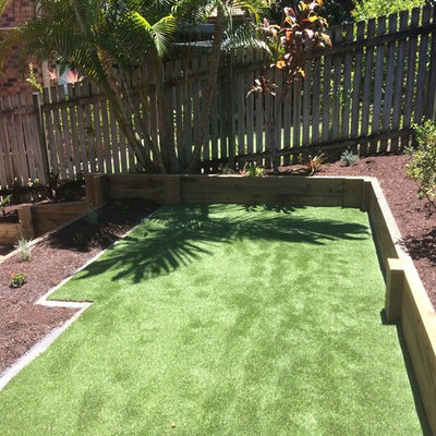 Inspiration for a small contemporary backyard formal garden in Brisbane.