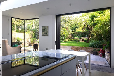 Design ideas for a medium sized contemporary back formal partial sun garden for summer in London.