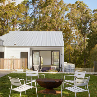 Inspiration for a large contemporary full sun garden in Other with a fire feature.