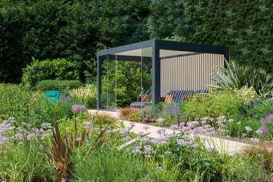 Design ideas for a medium sized contemporary back garden in Surrey.