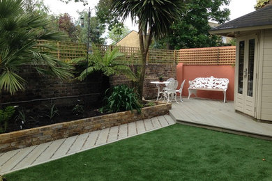 Inspiration for a small contemporary back partial sun garden for summer in Sussex with brick paving.