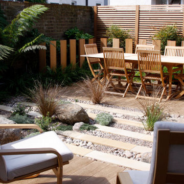 Ragstone, pebbles and plank paving