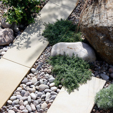 Ragstone, pebbles and plank paving