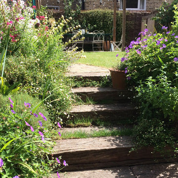 Railway sleepers serving as steps and raised beds