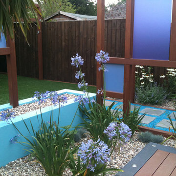 Raised flower beds in blue with perspex in wooden frames
