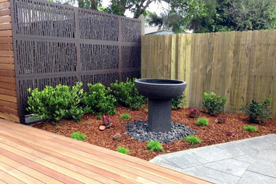 Photo of a modern back garden in Sydney with decking.