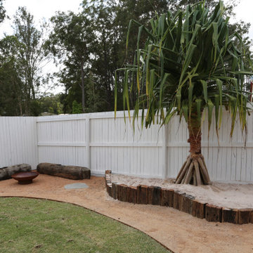 Sand pit with pandanus tree feature