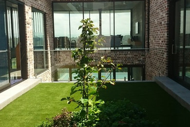 Exempel på en liten modern trädgård