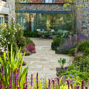 This is an example of a mediterranean garden in Other with with path.