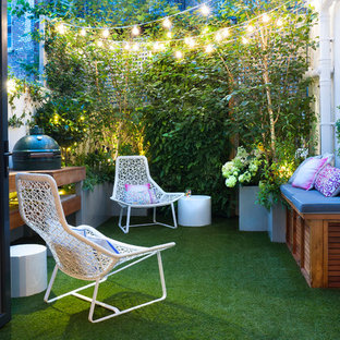 This is an example of a small contemporary back garden in Hertfordshire with a bbq area.