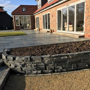 Slate patio, slate walling and gravel side pathway in Storrington