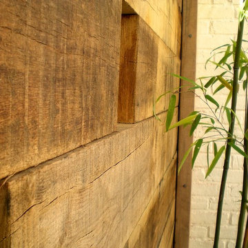 small courtyard space, wooden partition wall
