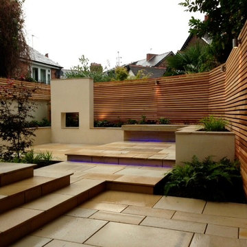 Small garden enhanced visually with horizontal Western Red Cedar Slatted Screens