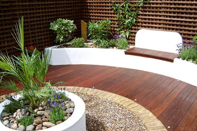 Photo of a contemporary garden in Other with decking.