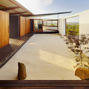 Photo of an asian full sun garden in Sydney with decking.