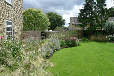 Photo of a contemporary back full sun garden in Other.