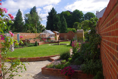 Design ideas for a traditional garden in Surrey.