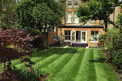 Photo of a medium sized modern back formal garden in London.