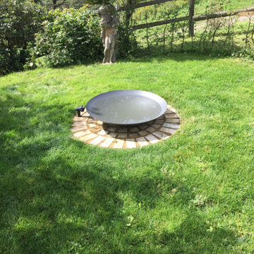 Water bowl in sheltered lawn area