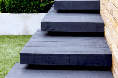 Modelo de jardín minimalista pequeño en patio trasero con jardín francés, privacidad y exposición parcial al sol