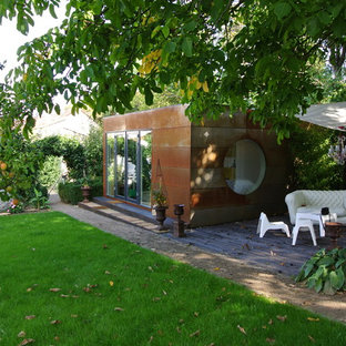 Design ideas for a mid-sized industrial detached granny flat in Munich.