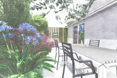 Immagine di un piccolo giardino moderno esposto a mezz'ombra in estate con pavimentazioni in cemento