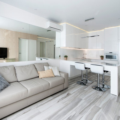 Example of a small trendy formal and open concept light wood floor living room design in Moscow with white walls and a wall-mounted tv
