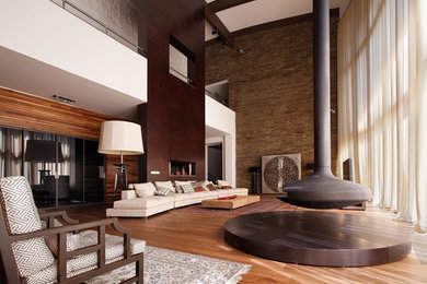 Идея дизайна: огромная парадная, открытая гостиная комната в современном стиле с коричневыми стенами и подвесным камином