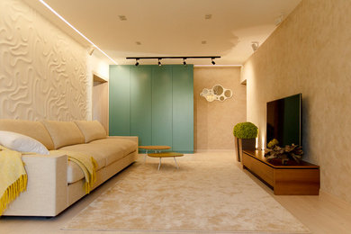 Foto di un grande soggiorno minimal chiuso con pareti bianche, parquet chiaro, nessun camino e parete attrezzata