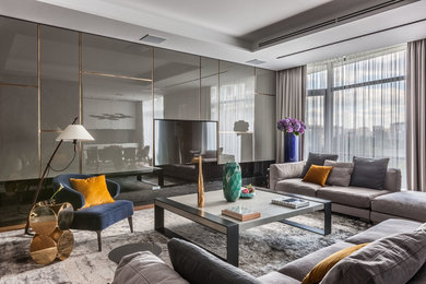 Идея дизайна: парадная, открытая гостиная комната в современном стиле с ковровым покрытием, телевизором на стене и серым полом