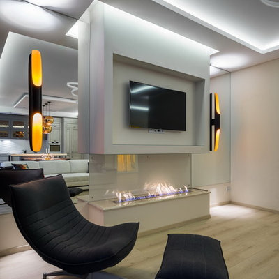 Example of a trendy formal and open concept living room design in Saint Petersburg with white walls, a ribbon fireplace and a wall-mounted tv