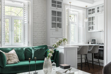 Идея дизайна: открытая, объединенная гостиная комната среднего размера в скандинавском стиле с белыми стенами, полом из винила, коричневым полом и кирпичными стенами без телевизора
