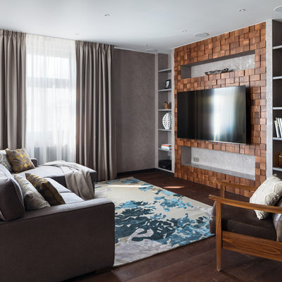 Example of a large trendy open concept brown floor and dark wood floor living room design in Moscow with gray walls and a wall-mounted tv