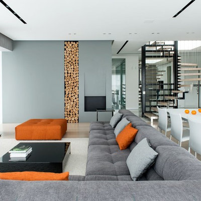 Example of a large trendy open concept and formal beige floor and light wood floor living room design in Moscow with gray walls and a wall-mounted tv