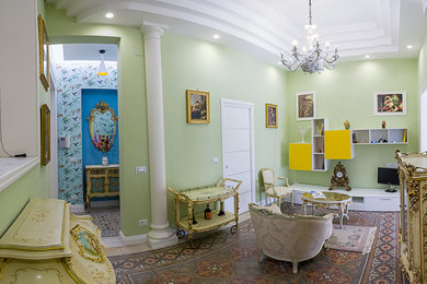 Diseño de salón para visitas tradicional de tamaño medio con paredes verdes, suelo de cemento y suelo multicolor