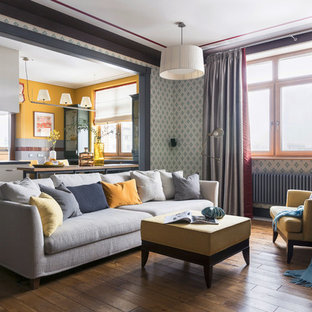 Photo of a traditional living room in London with multi-coloured walls, brown floors and painted wood flooring.