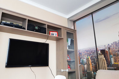 Идея дизайна: гостиная комната среднего размера в современном стиле с телевизором на стене
