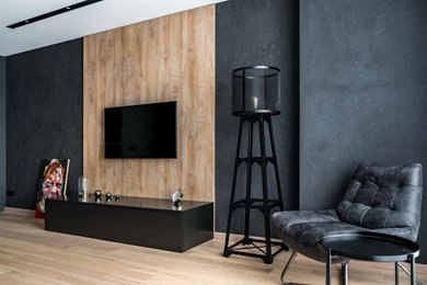 На фото: гостиная комната среднего размера в современном стиле с черными стенами с