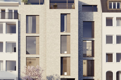 Modernes Reihenhaus mit Steinfassade, beiger Fassadenfarbe und Flachdach in Hamburg