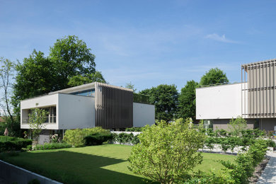 Modelo de fachada de casa minimalista con tejado plano