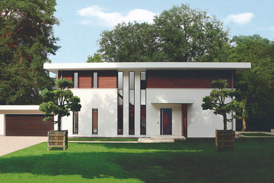 Mittelgroßes, Zweistöckiges Modernes Haus mit Mix-Fassade, weißer Fassadenfarbe und Flachdach in Berlin