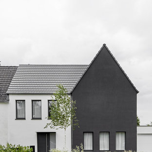 Kleines, Dreistöckiges Modernes Einfamilienhaus mit Putzfassade, Satteldach und Ziegeldach in Köln