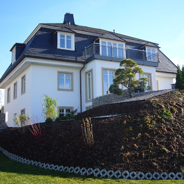 Haus Hillebrand - Holzhaus mit Mansarddach und Putzfassade