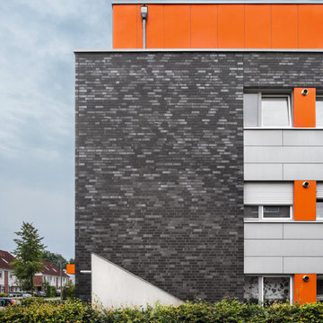 Mehrfamilienhaus W18 mit Penthouse und orangefarbenen Dach