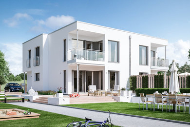 Großes, Zweistöckiges Modernes Haus mit Putzfassade, weißer Fassadenfarbe und Flachdach