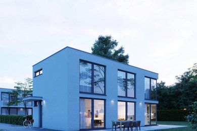 Ejemplo de fachada de casa blanca actual de dos plantas con tejado plano