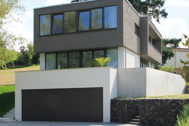 Großes, Dreistöckiges Modernes Einfamilienhaus mit Putzfassade und Flachdach in Sonstige